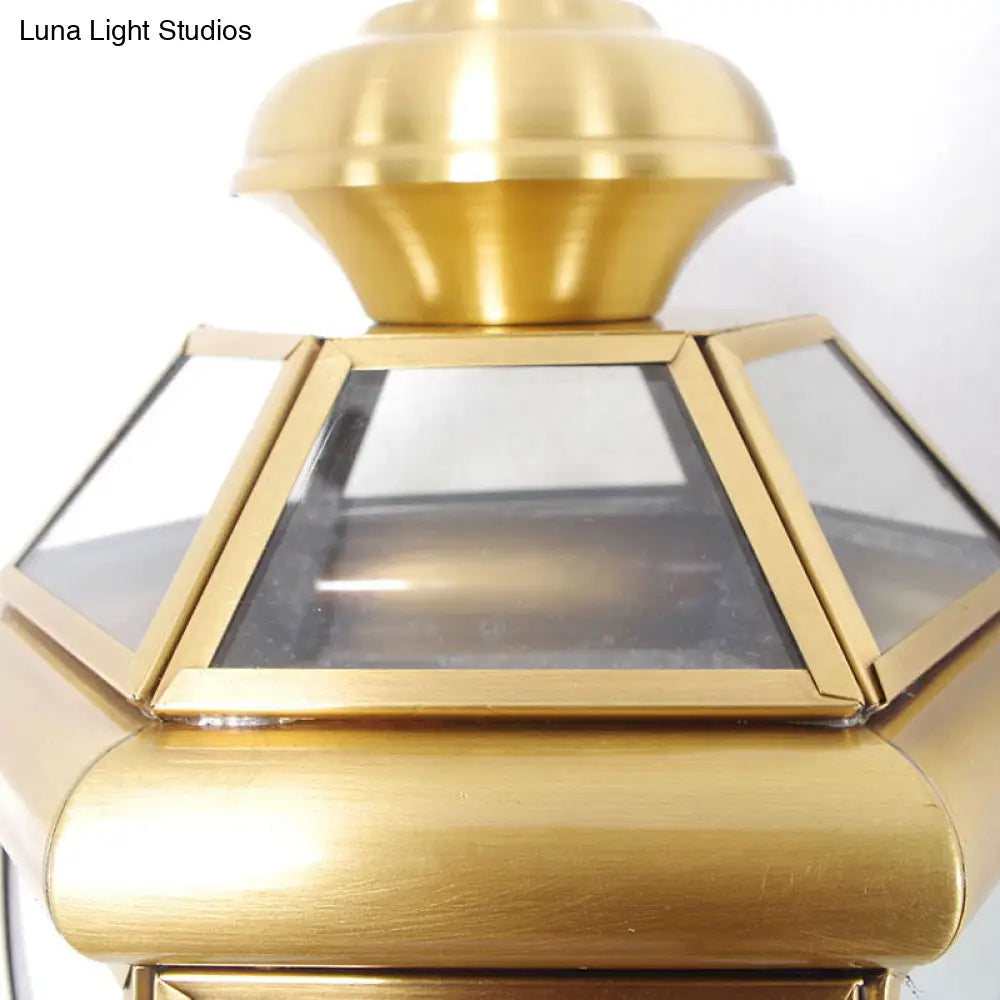 Brass Wall Sconce With Clear Glass Urn And Curved Arm Single Bulb Light Fixture