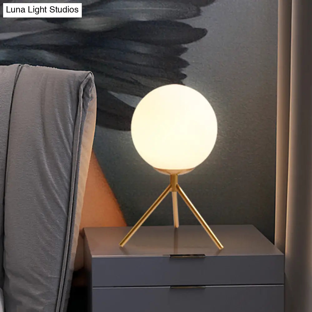 Modern Opal Glass Sphere Desk Lamp With Metal Tripod In Gold/Black