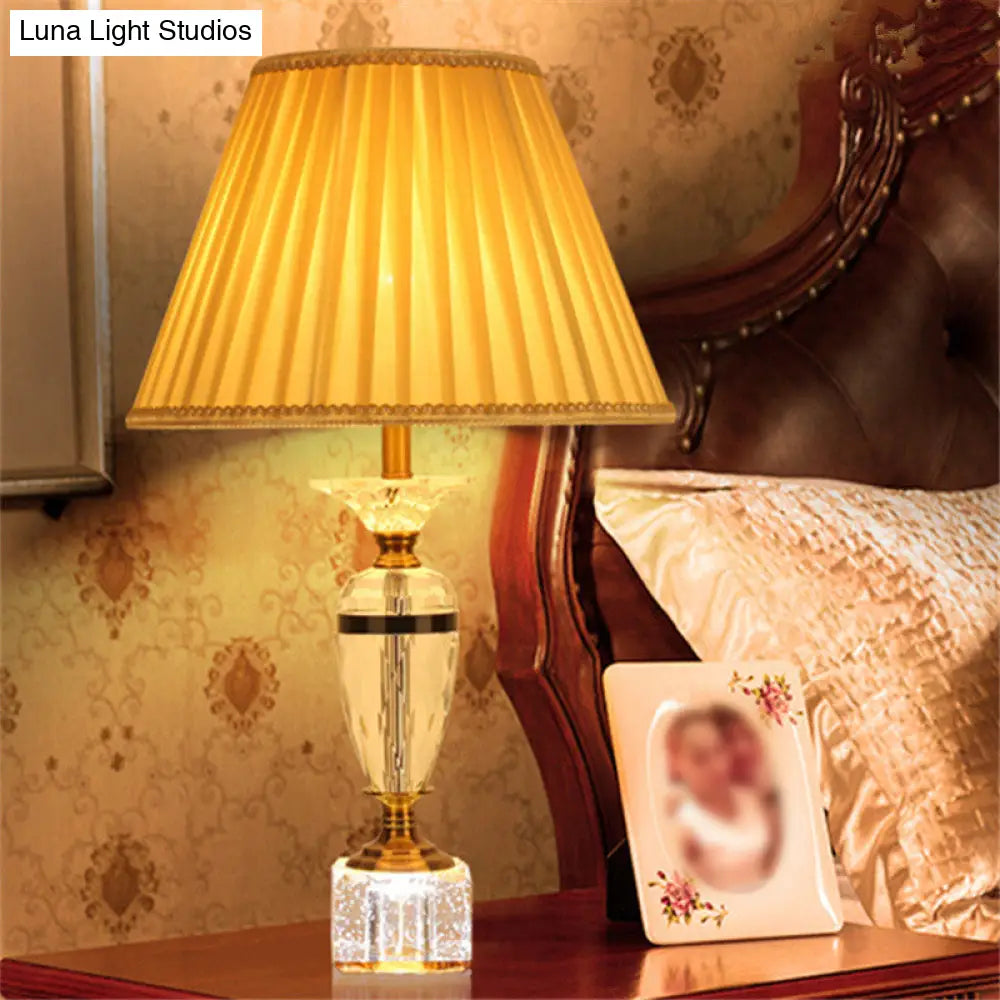 Modern Urn Shape Fabric Desk Light - Faceted Crystal 1 Bulb Night Table Lamp In Beige