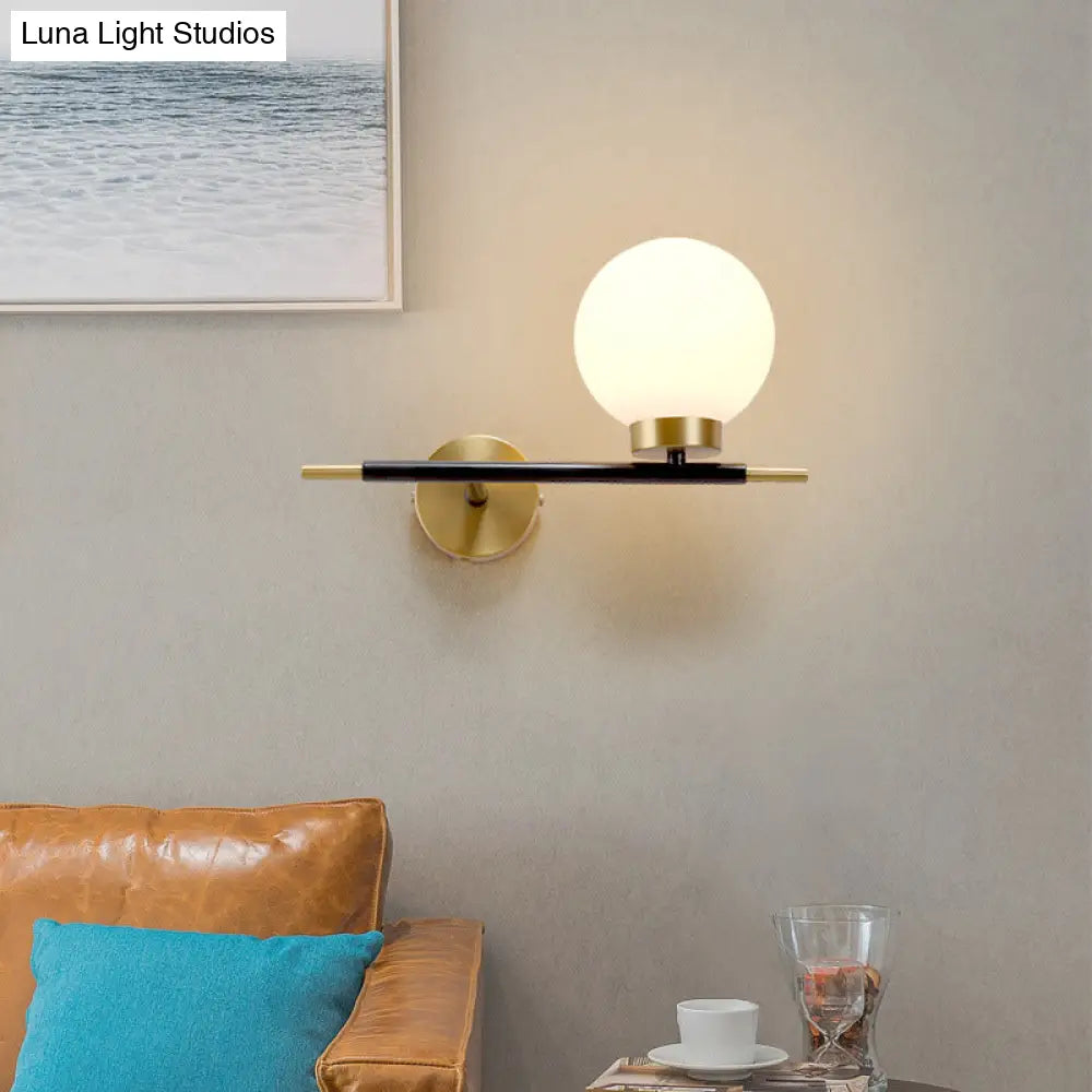 Post-Modern White Glass Sphere Wall Sconce With Brass Finish - 1/2 Bulbs