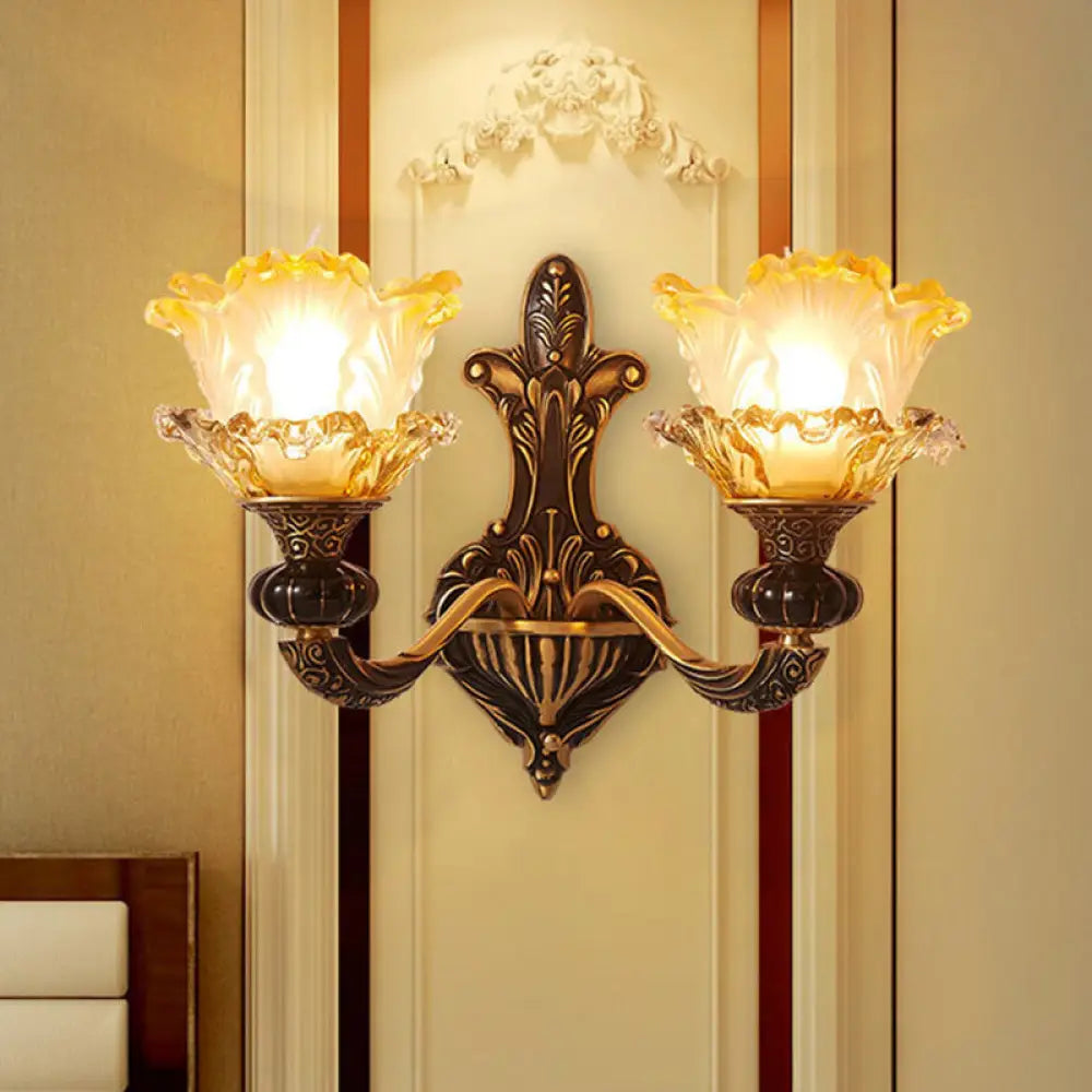 Rustic Half-Head Wall Lamp With Curvy Metallic Design And Flower Amber Glass Shade - Brass Finish 2