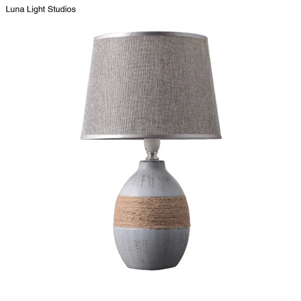Traditional Flaxen/Grey Nightstand Lamp With Ceramic Base - 1-Light Fabric Drum Desk Light
