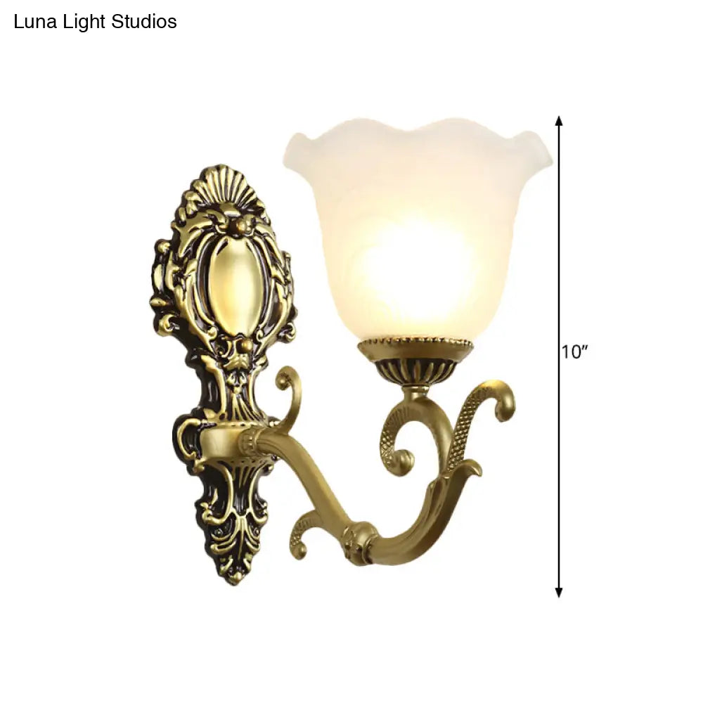 Vintage Brass/Beige Frosted Ribbed Glass Wall Sconce Lamp With Curvy Arm - 1 Light Bloom