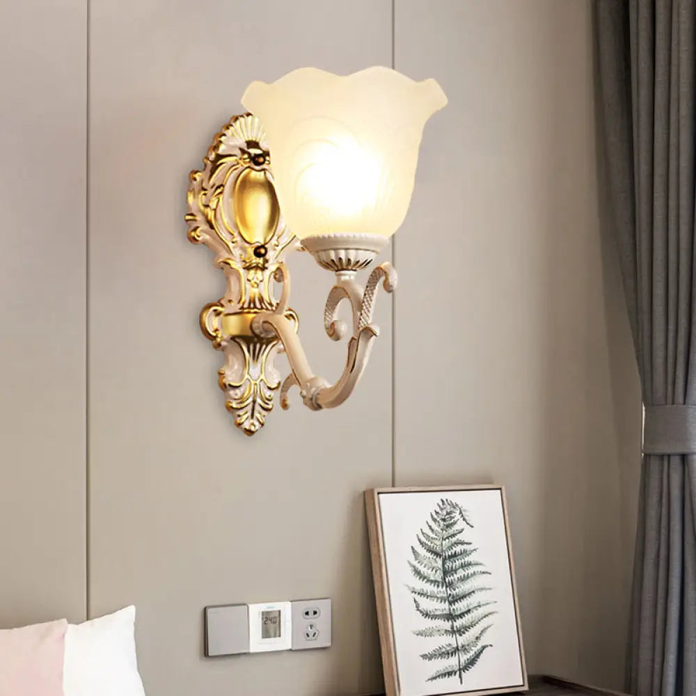 Vintage Brass/Beige Frosted Ribbed Glass Wall Sconce Lamp With Curvy Arm - 1 Light Bloom Beige