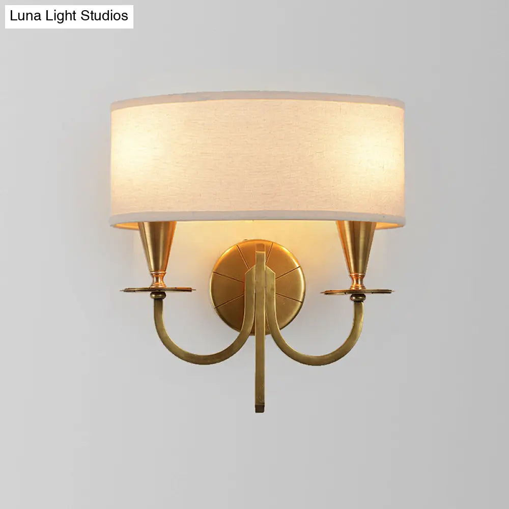Vintage Brass Cylinder Wall Sconce With Fabric Shade And Arched Metal Arm - Ideal For Bedroom