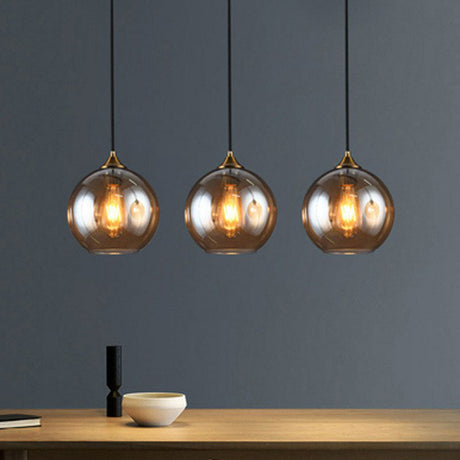 Antiqued Brass Globe Pendant Lamp With Postmodern Design And Glass Shades Amber / Linear