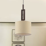 Modernist Brown Wood Hanging Lamp Kit With Carved Design Down Lighting And Drum Fabric Shade - 1