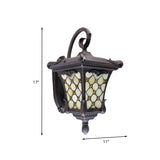 Rustic Black Wall Sconce With Scrolled Arm And Frosted Glass For Outdoor Use