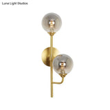 Amber/Smoke Gray Glass 2-Head Led Wall Sconce - Sphere Bathroom Mount Light With Brass Finish