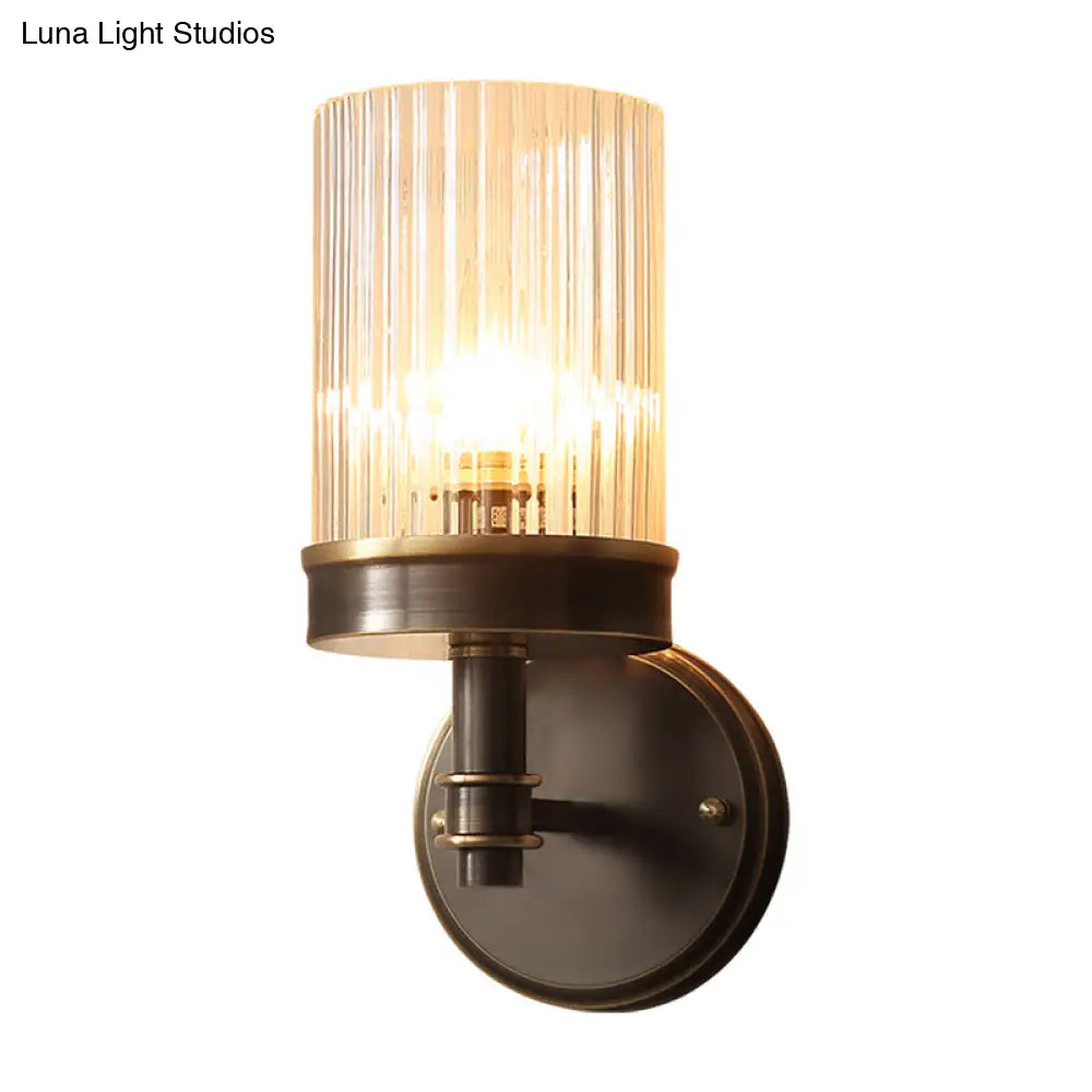 Antiqued Black Glass Wall Sconce Light Fixture With Clear Cylindrical Shade - Ideal For Bedroom