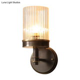 Antiqued Black Glass Wall Sconce Light Fixture With Clear Cylindrical Shade - Ideal For Bedroom