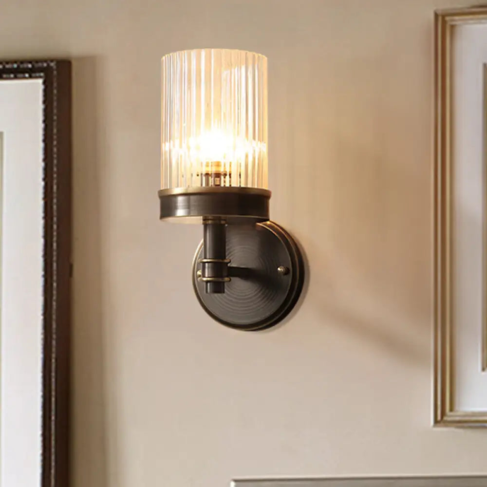 Antiqued Black Glass Wall Sconce Light Fixture With Clear Cylindrical Shade - Ideal For Bedroom