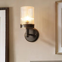 Antiqued Black Glass Wall Sconce Light Fixture With Clear Cylindrical Shade - Ideal For Bedroom