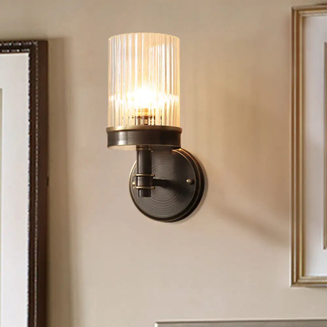 Antiqued Black Glass Wall Sconce Light Fixture With Clear Cylindrical Shade - Ideal For Bedroom