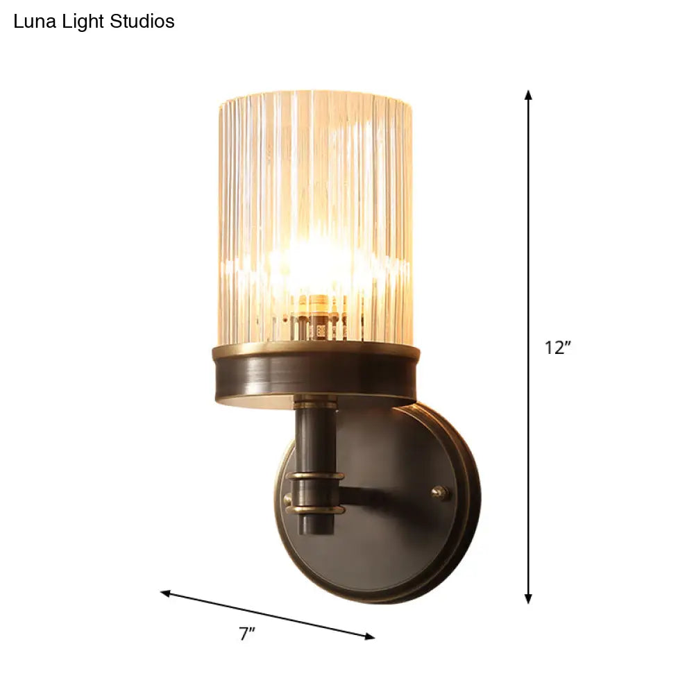 Antiqued Black Glass Wall Sconce Light Fixture With Clear Cylindrical Shade - Ideal For Bedroom
