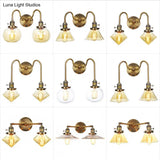 Antiqued Brass Wall Mounted Lamp With Conical/Spherical Shades And Adjustable Arms - 2-Light Fixture