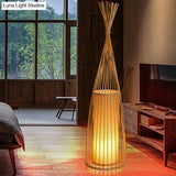 Bamboo Floor Lamp From South-East Asia With Tapered Design And Cylindrical Shade