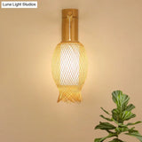 Bamboo Wall Sconce With Asian Style And Beige Oblong Shade - Hand Woven 1-Bulb Lamp