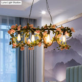 Black Metal 4-Light Linear Island Lamp With Hanging Artificial Plant - Lodge Style