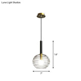 Black Textured Glass Dining Room Pendant With Modern Spherical Hanging Design