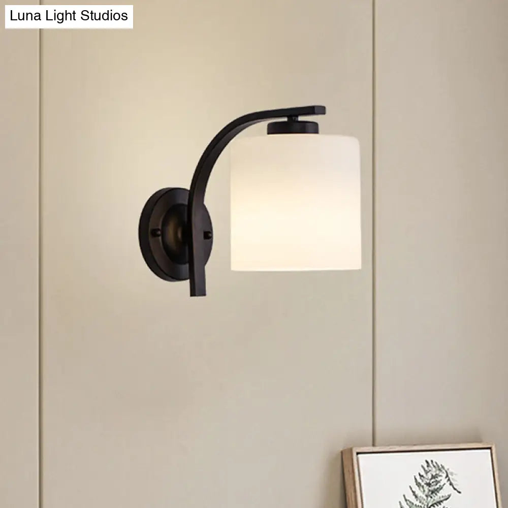 Black Wall Sconce With Ivory Glass Cylinder And Curved Arm - 1-Light Mounted Lamp