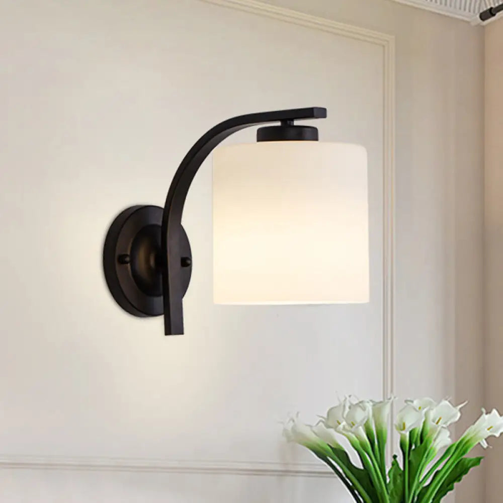 Black Wall Sconce With Ivory Glass Cylinder And Curved Arm - 1-Light Mounted Lamp