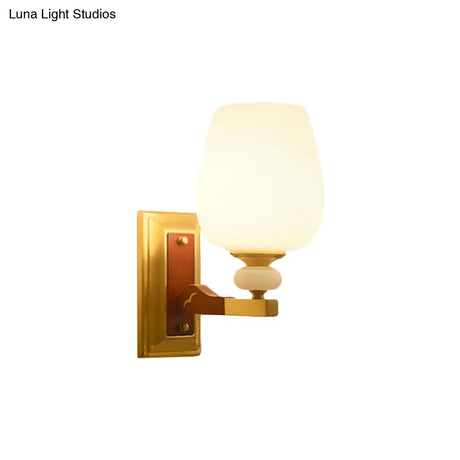 Brass Single Light Wall Mount Lamp With Opal Glass Cup Shape - Angled Lighting Idea