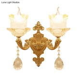 Brass Wall Mount Sconce With Scrolled Arms Glass Blossom Shade And Crystal Accents