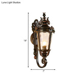 Clear Water Glass Outdoor Wall Sconce: Scrolled Arm 1-Light Black & Gold Lodge Lighting