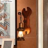 Coastal Clear Glass Lantern Sconce Light With Wooden Backplate - Rustic One-Light Fixture