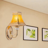 Colonial Gold Bell Wall Sconce With Beveled Glass And Arched Arm For Indoor Use