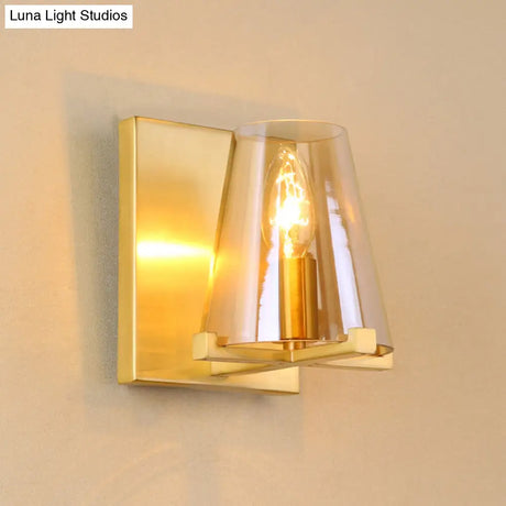Colonial Wall Sconce: Clear Glass Cone-Shaped Light Fixture With Brass Mount For Kitchen