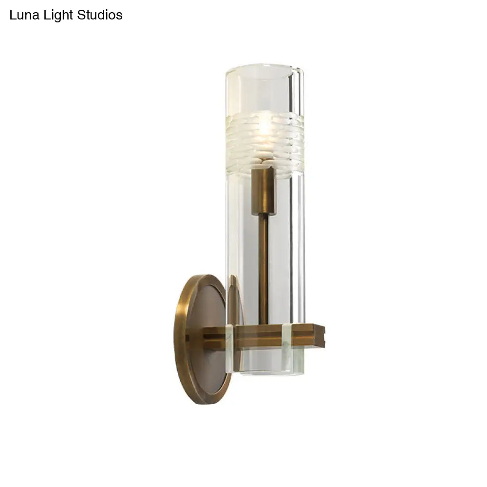 Colonialist Gold Wall Sconce With Clear Cylindrical Glass - Perfect For Living Room Lighting