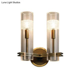 Colonialist Gold Wall Sconce With Clear Cylindrical Glass - Perfect For Living Room Lighting