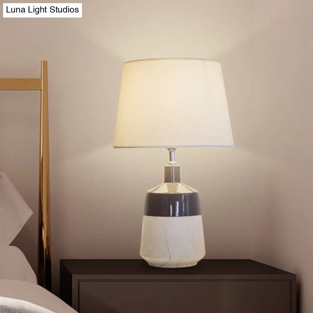 Contemporary 1-Head Bedside Night Lamp In White With Ceramic Base: Fabric Drum Table Lighting