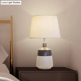 Contemporary 1-Head Bedside Night Lamp In White With Ceramic Base: Fabric Drum Table Lighting