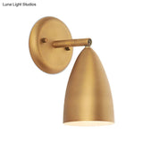Contemporary Brass Bedroom Sconce - Elongated Dome Wall Mount Lamp