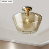 Contemporary Brass Flush Ceiling Fixture With Amber Glass Lampshade