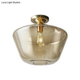 Contemporary Brass Flush Ceiling Fixture With Amber Glass Lampshade