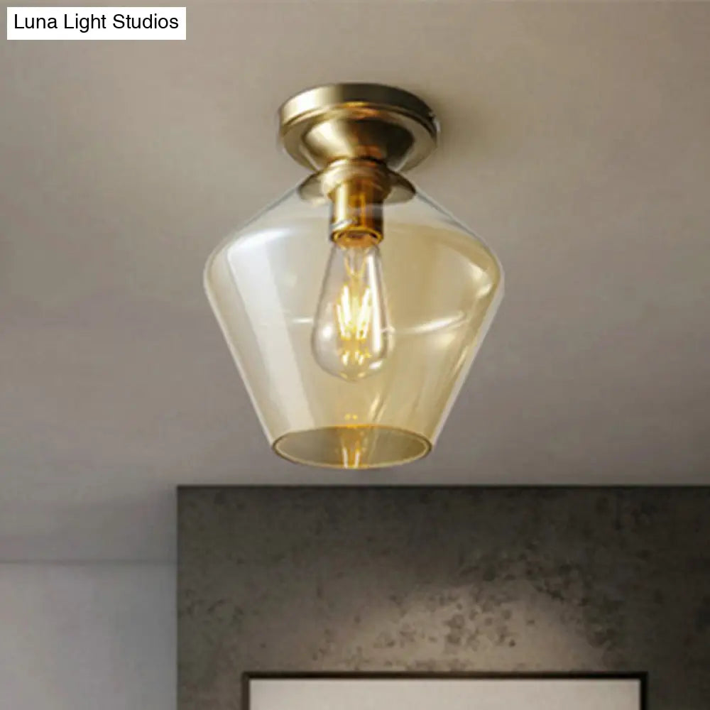 Contemporary Brass Flush Ceiling Fixture With Amber Glass Lampshade