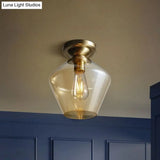 Contemporary Brass Flush Ceiling Fixture With Amber Glass Lampshade