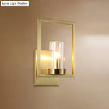 Contemporary Brass Wall Sconce With Clear Glass Shade - Cylindrical Bedroom Light Fixture