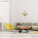 Contemporary Crystal Wall Sconce With Curved Arm And Brass Finish