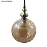 Contemporary Hammered Glass Pendant Light for Boutique Kitchen - 1 Bulb Globe Suspension Light