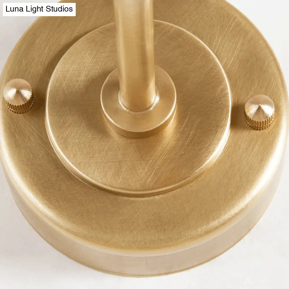 Contemporary Hand Blown Glass Wall Light With Brass Globe And Crossed Arm