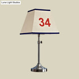 Contemporary Metal Table Lamp With Number Pattern For Bedroom - Beige Night Lighting