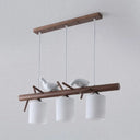Contemporary Wood Island Pendant With Nutcracker Design And Cylindrical Glass Shades - Set Of 3