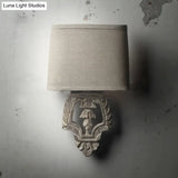 Country Style 1-Light Fabric Wall Sconce With Carved Backplate - Brown Finish