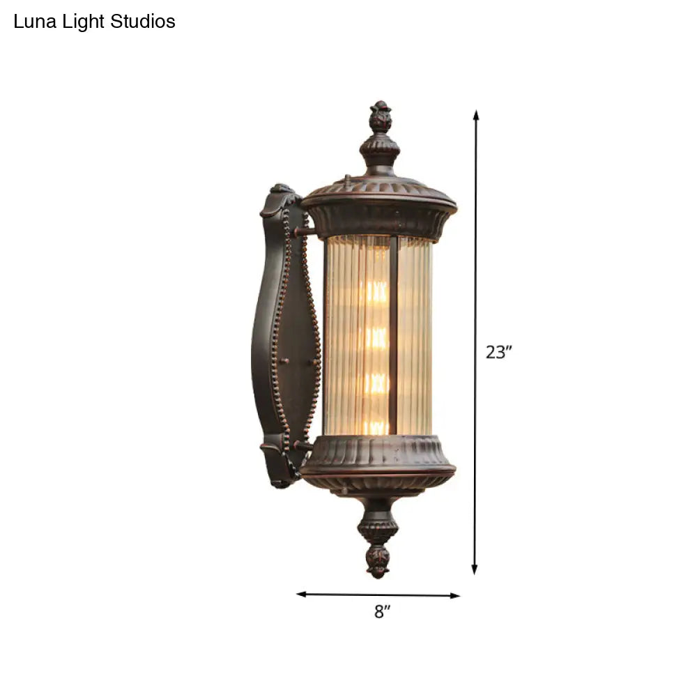Country-Style Black Wall Sconce Lamp With Clear Ribbed Glass Cylinder Light