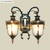 Countryside Black/Gold-Copper Urn Wall Sconce Light With Clear Glass - 2 Bulbs